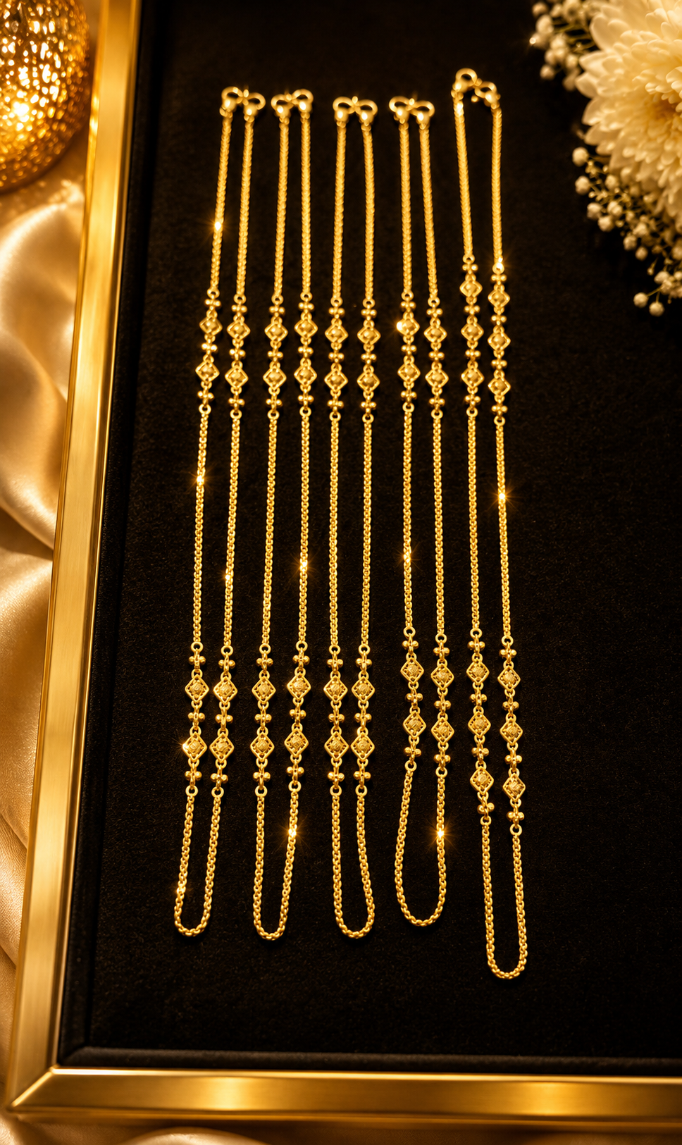 Fine gold chain collection arranged on black velvet
