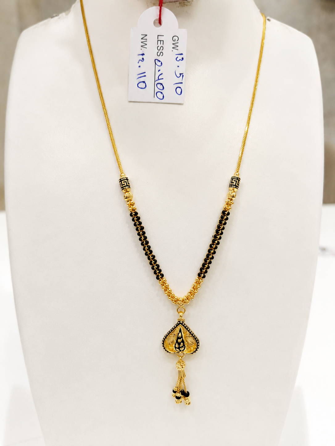 22K gold mangalsutra with black beads and meenakari teardrop pendant, 13.110 grams