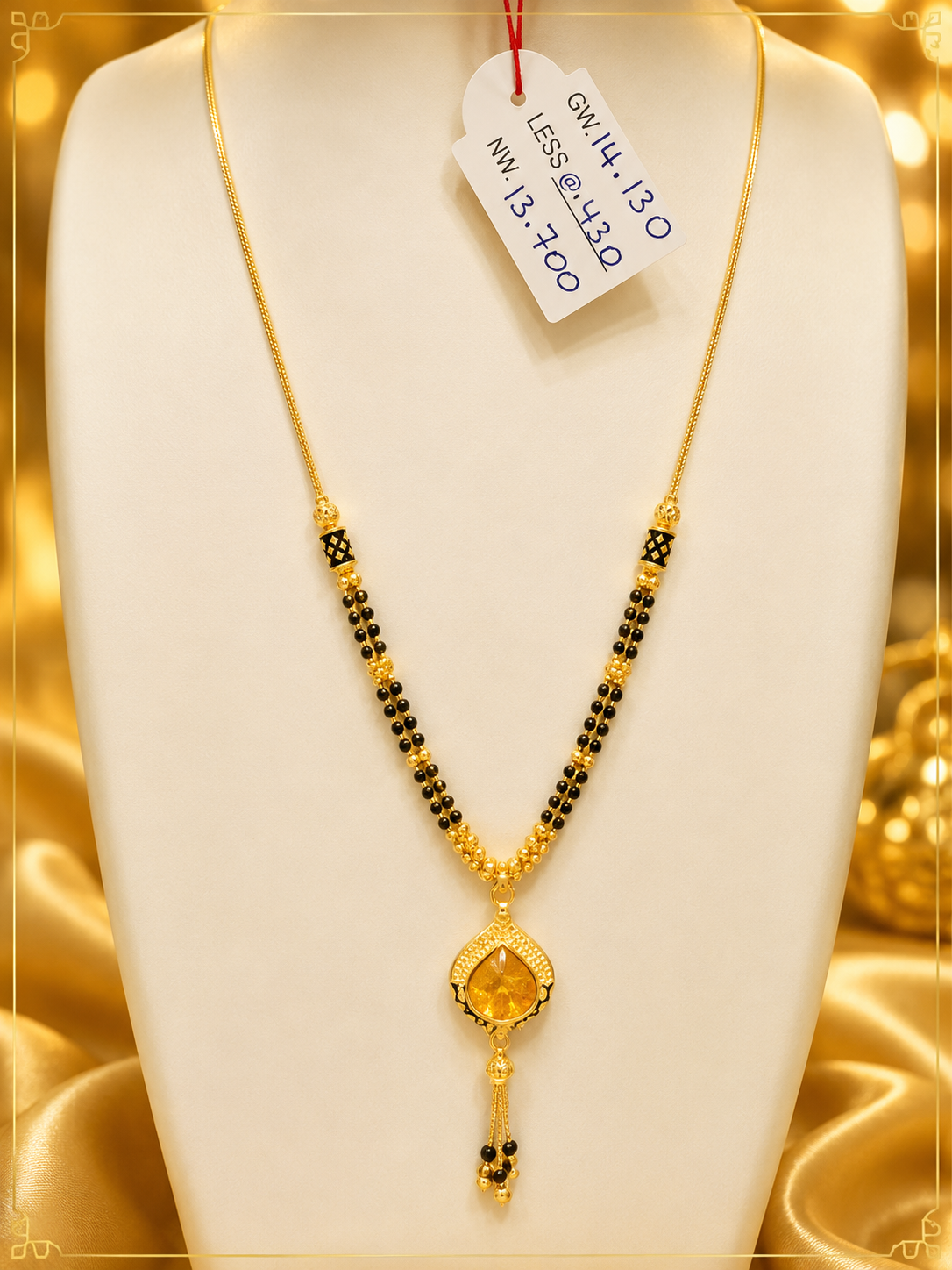 22K gold mangalsutra with double-line black beads and citrine teardrop pendant, 13.700 grams